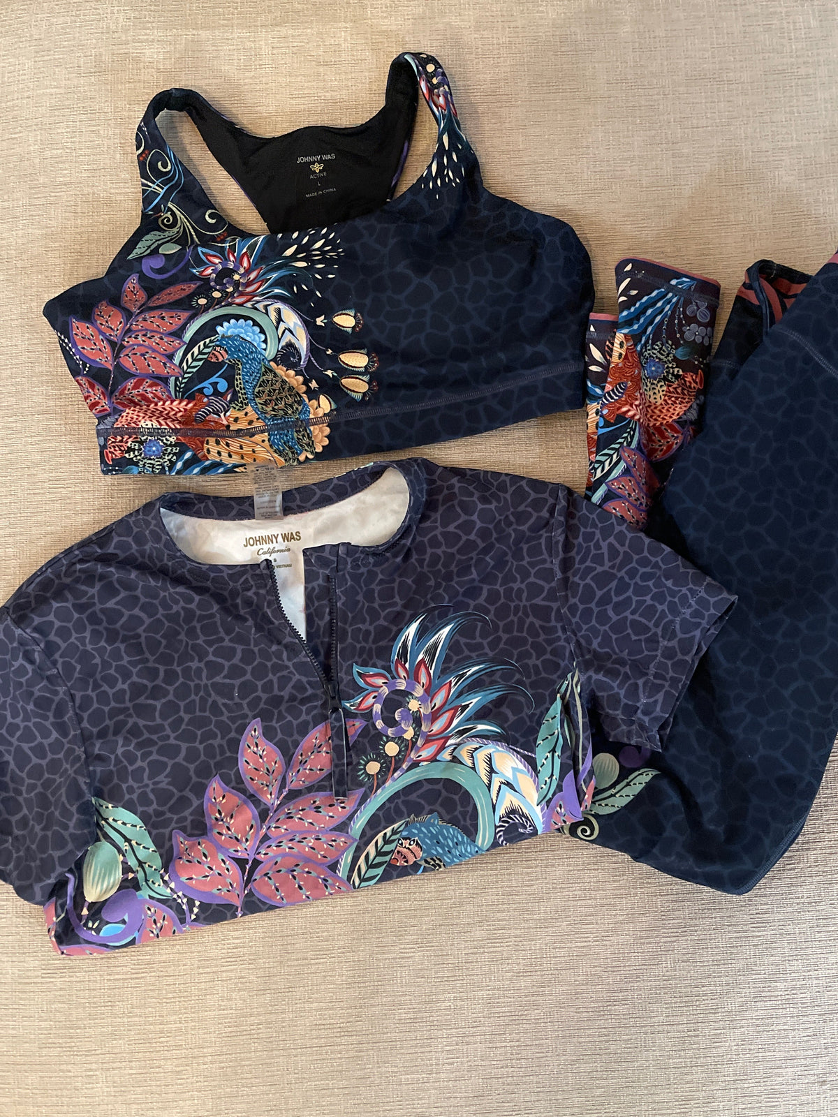 Johnny Was featuring a floral and bee print in dark blue tones.