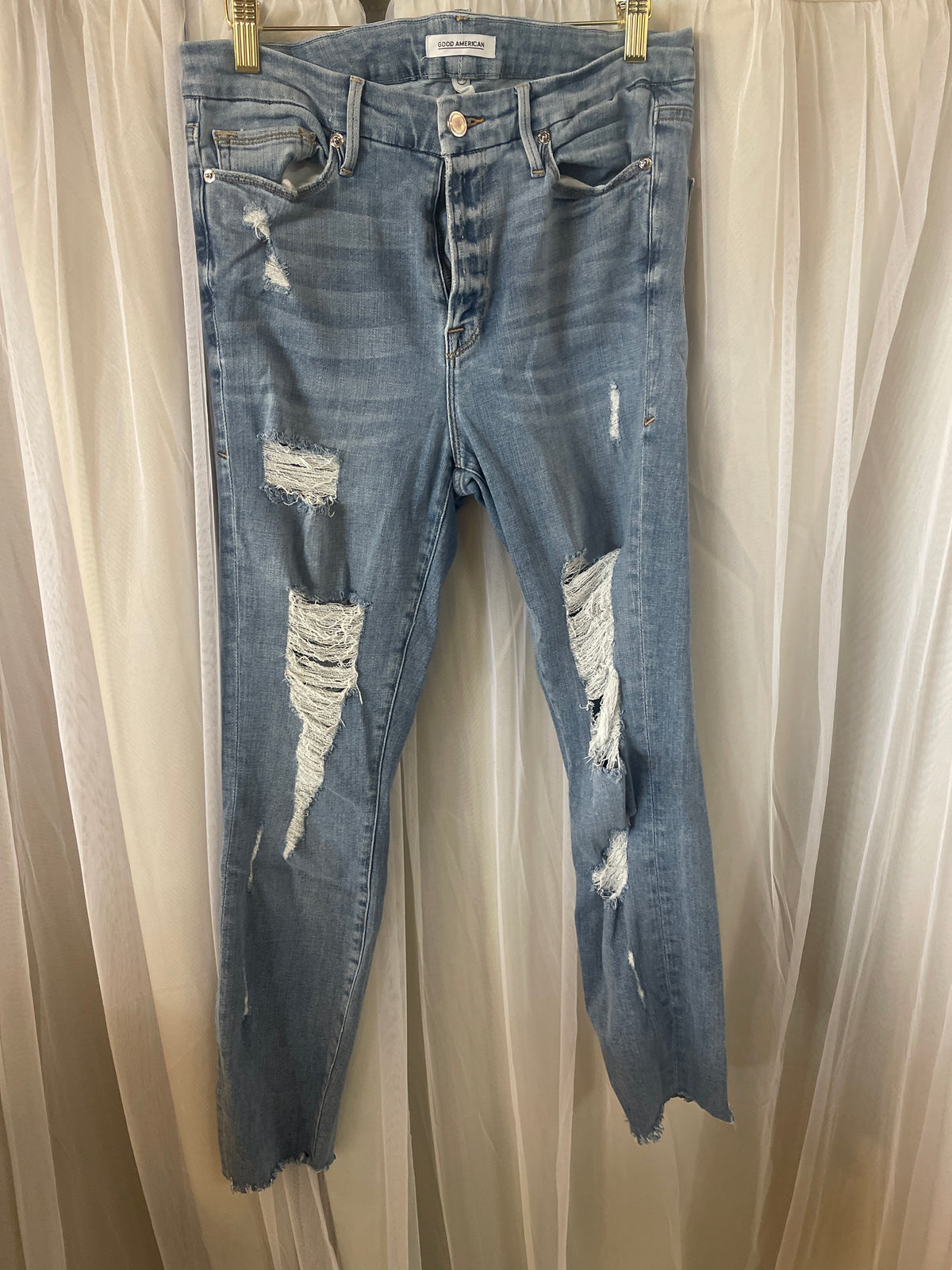Good American light-wash, intentionally distressed skinny jeans f
