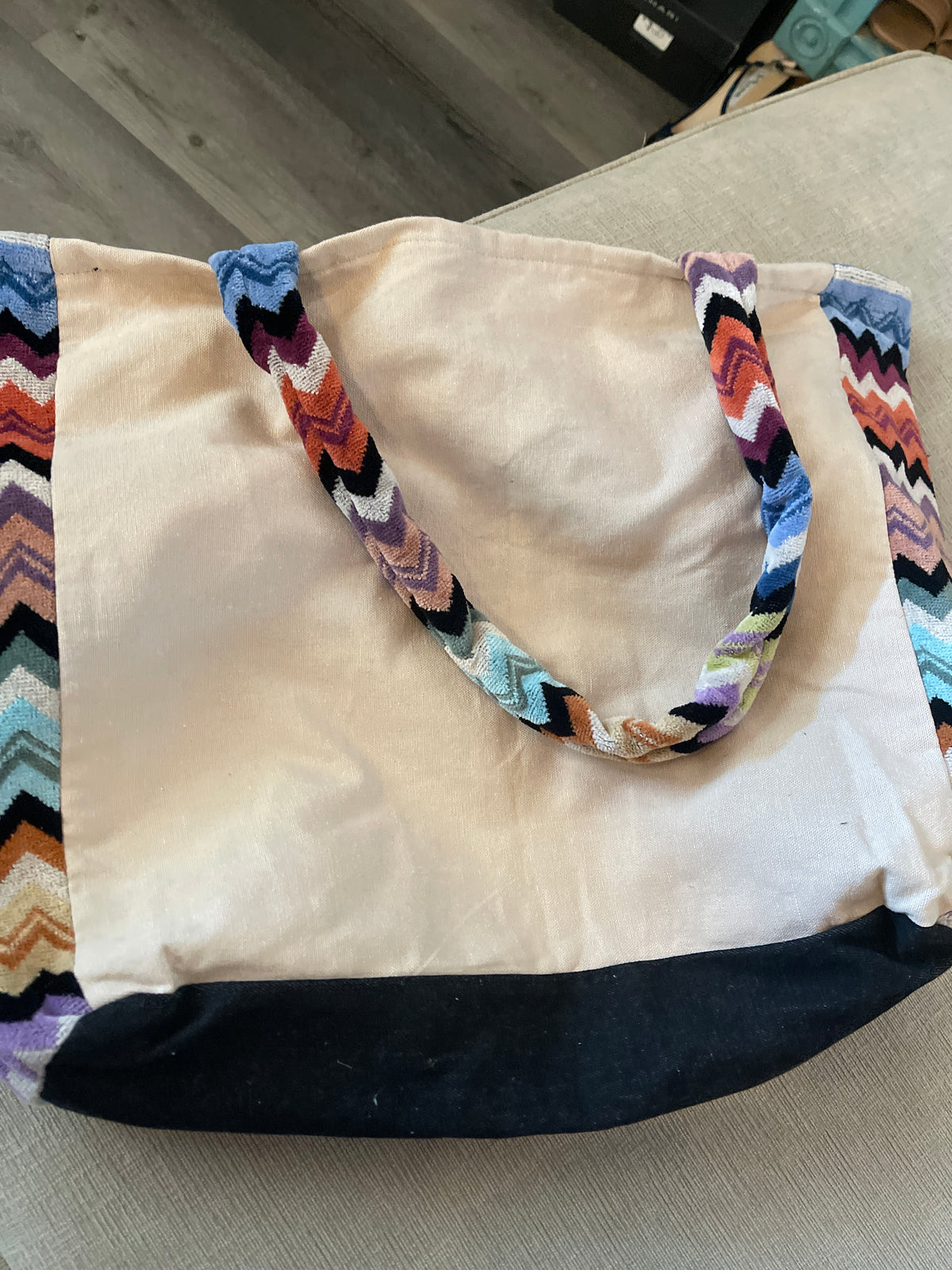 custom beach bag made from a repurposed Hermès towel with a multi-colored velour or terry cloth strap