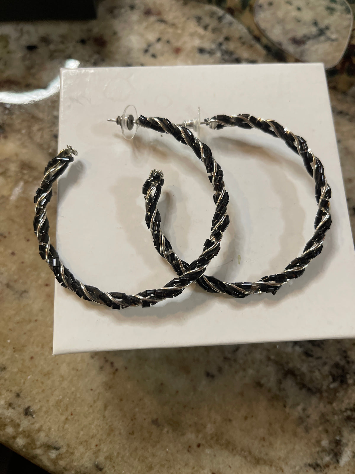 Silver and black hoop earrings