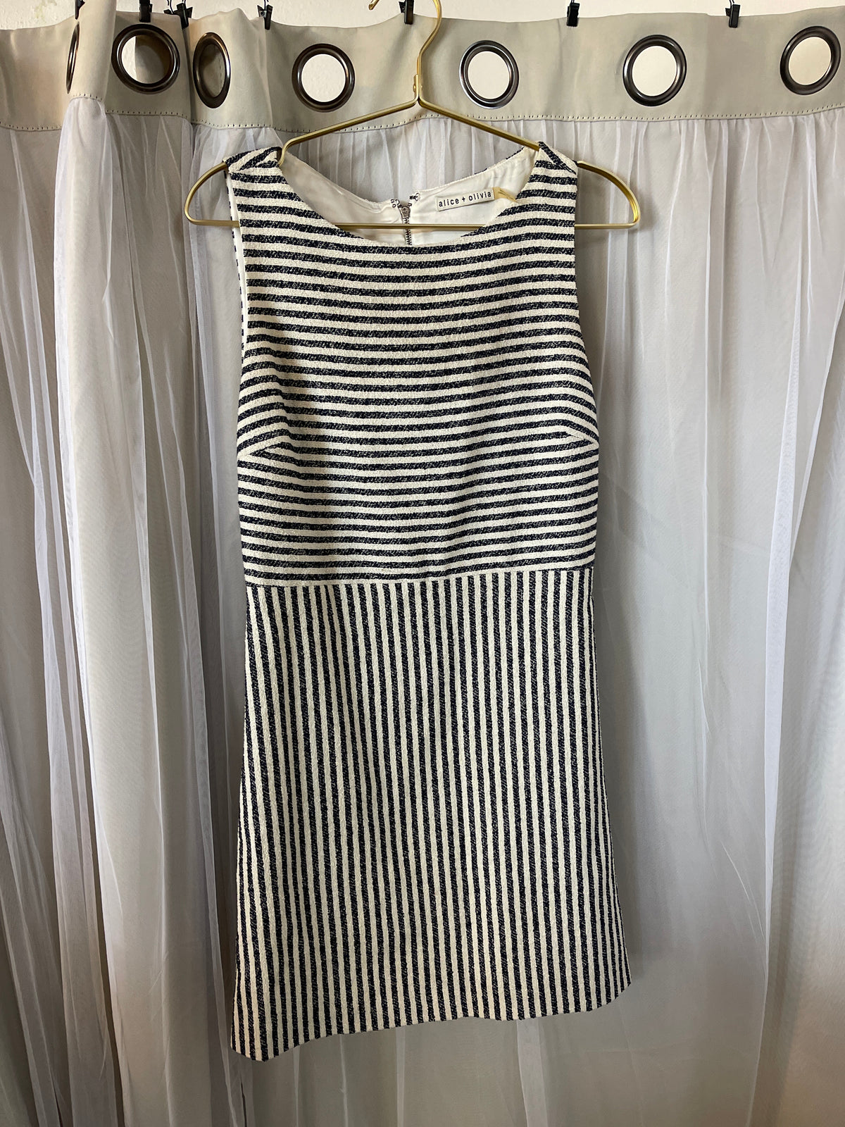 The Alice + Olivia sleeveless striped mini dress