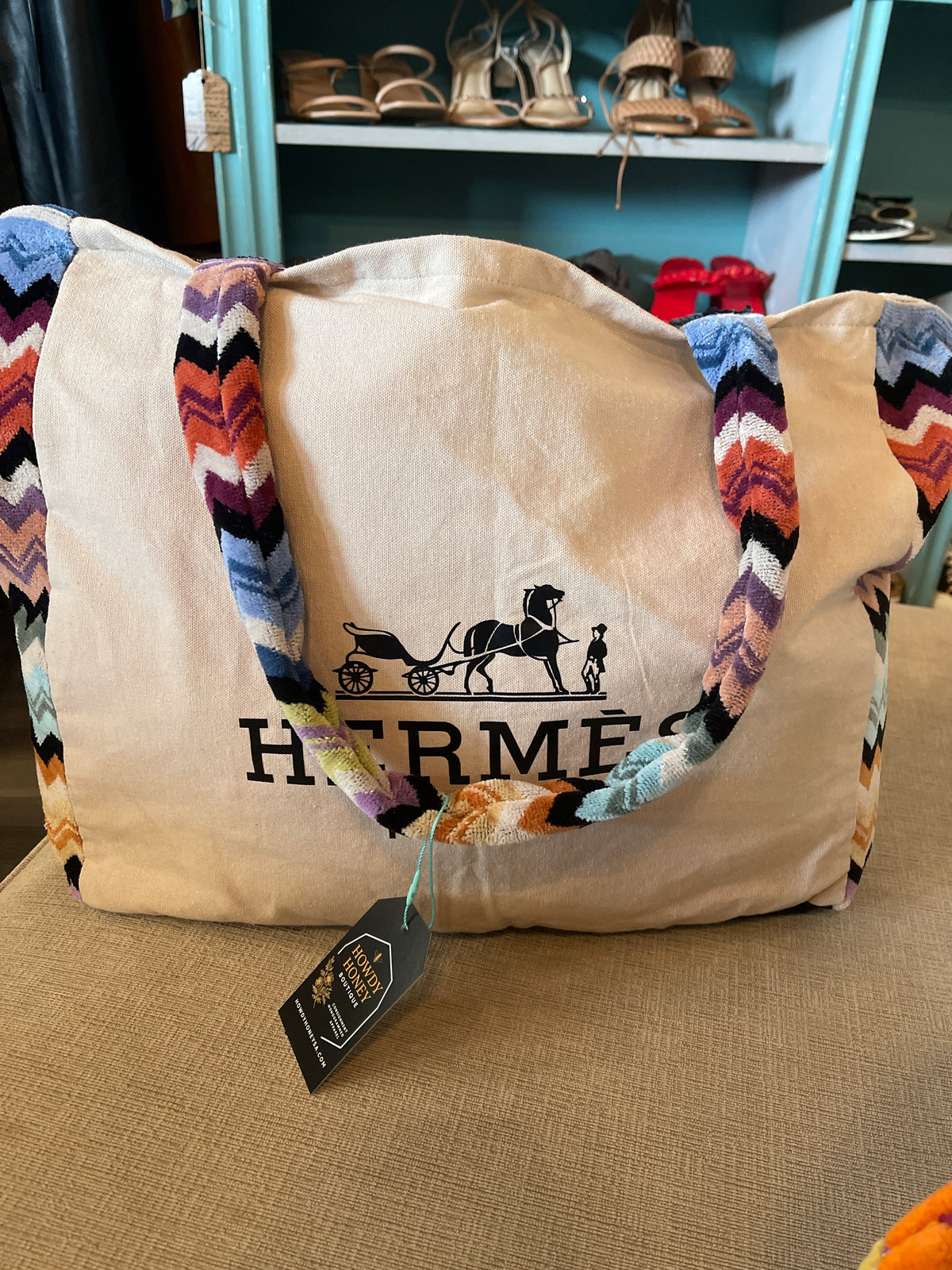 custom beach bag made from a repurposed Hermès towel with a multi-colored velour or terry cloth strap