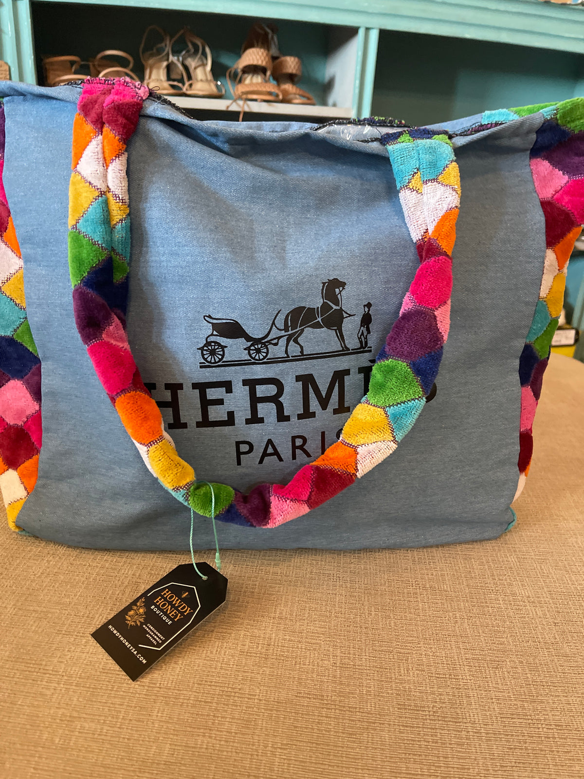 custom beach bag made from a repurposed Hermès towel with a multi-colored velour or terry cloth strap