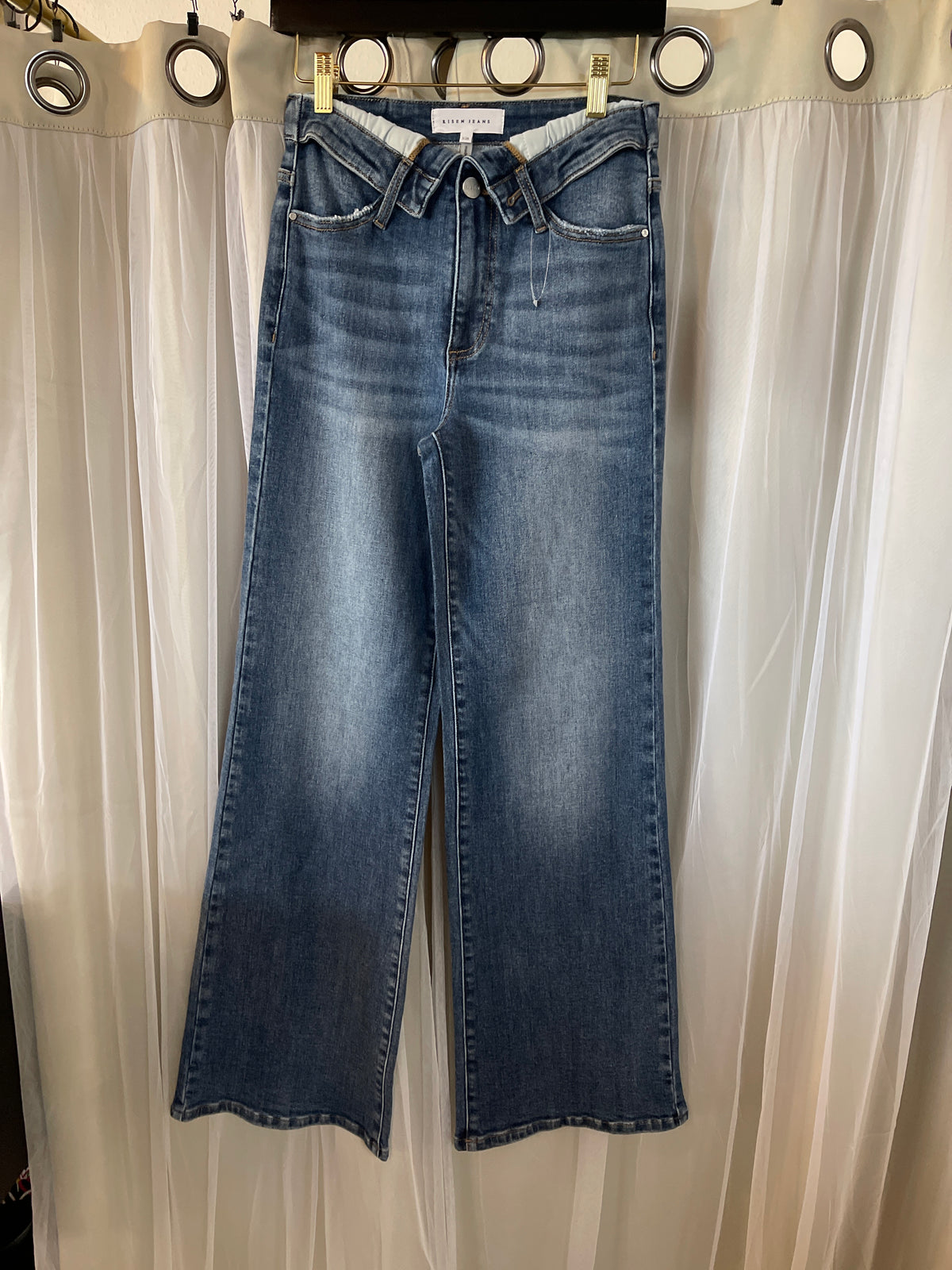 Risen High-Rise Wide-Leg Jeans featuring a distinctive V-Dipped / Crossover front waistband