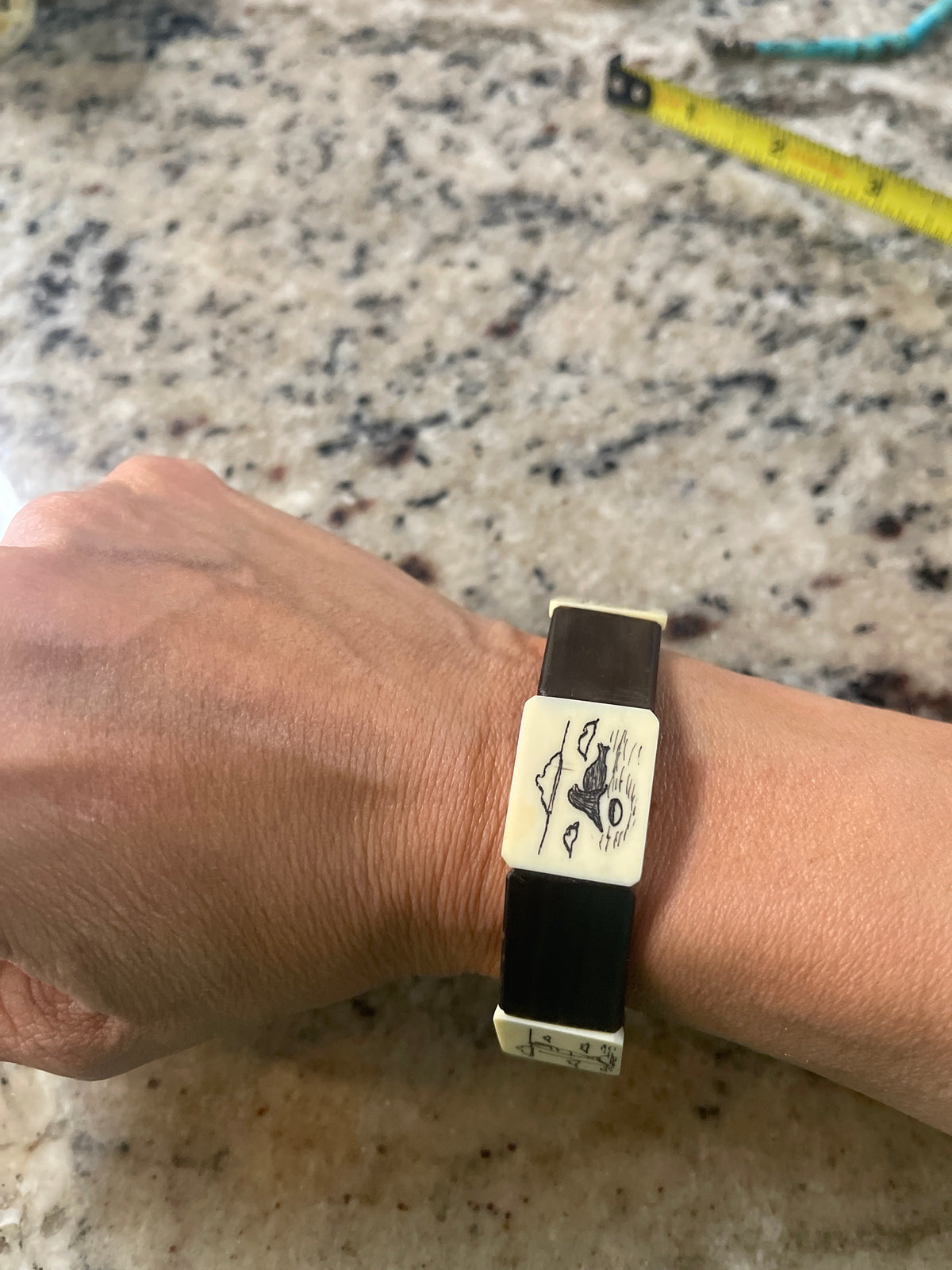vintage Alaskan scrimshaw "story" panel stretch bracelet,