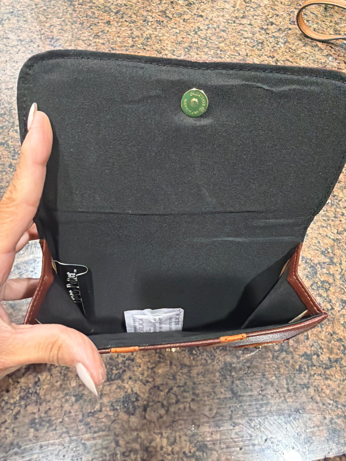 Harry Potter "School of Witchcraft and Wizardry" trunk-style crossbody bag and wallet hybrid.