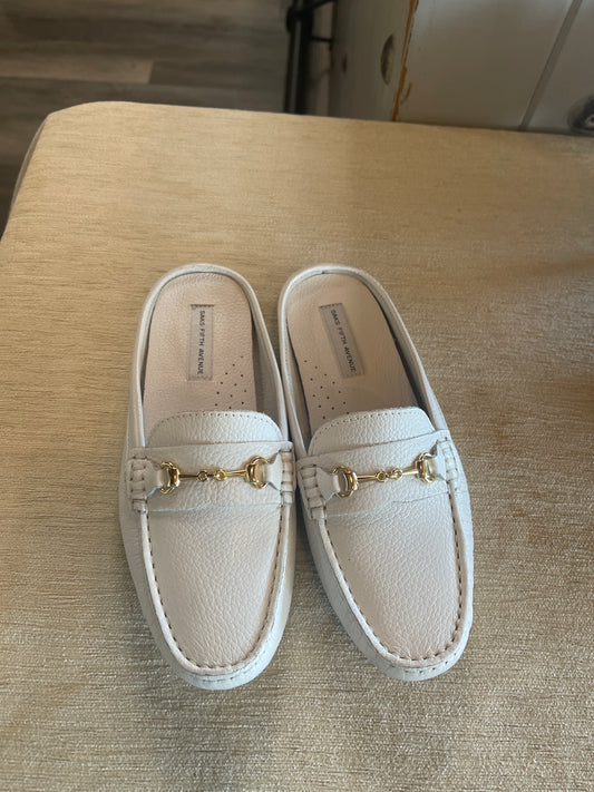 These Saks Fifth Avenue slip-on leather loafers feature a prominent gold-tone horsebit accent