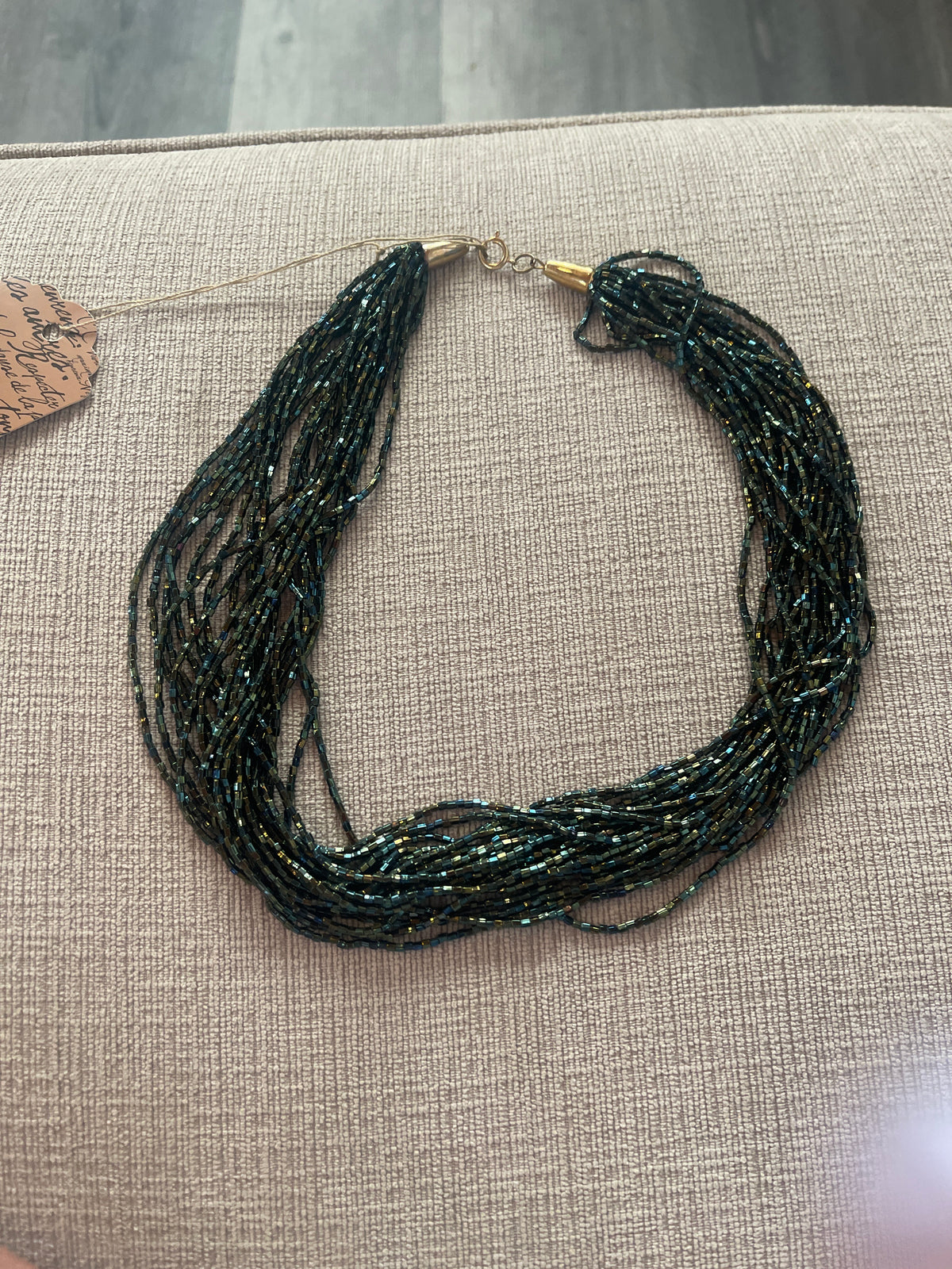 Multi-strand iridescent beaded necklace